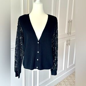 Black cardigan with lace sleeves and pearl buttons
